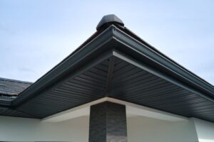 soffit installed on the underside of roofing eaves with matching gutters